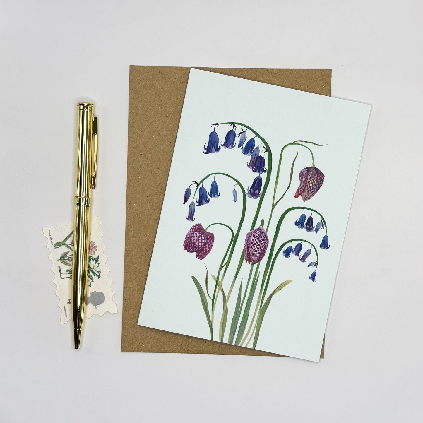 Native bluebell Greeting card with wildflower floral snake head fritillary design on a white background