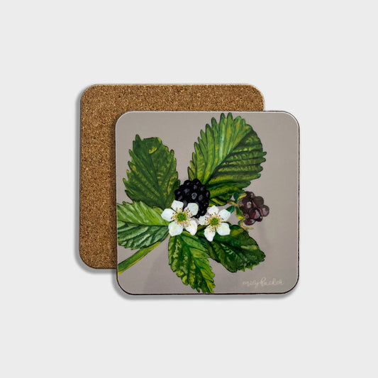 A square coaster with a cork backing, featuring a hand-painted illustration of blackberries and leaves on a grey background.