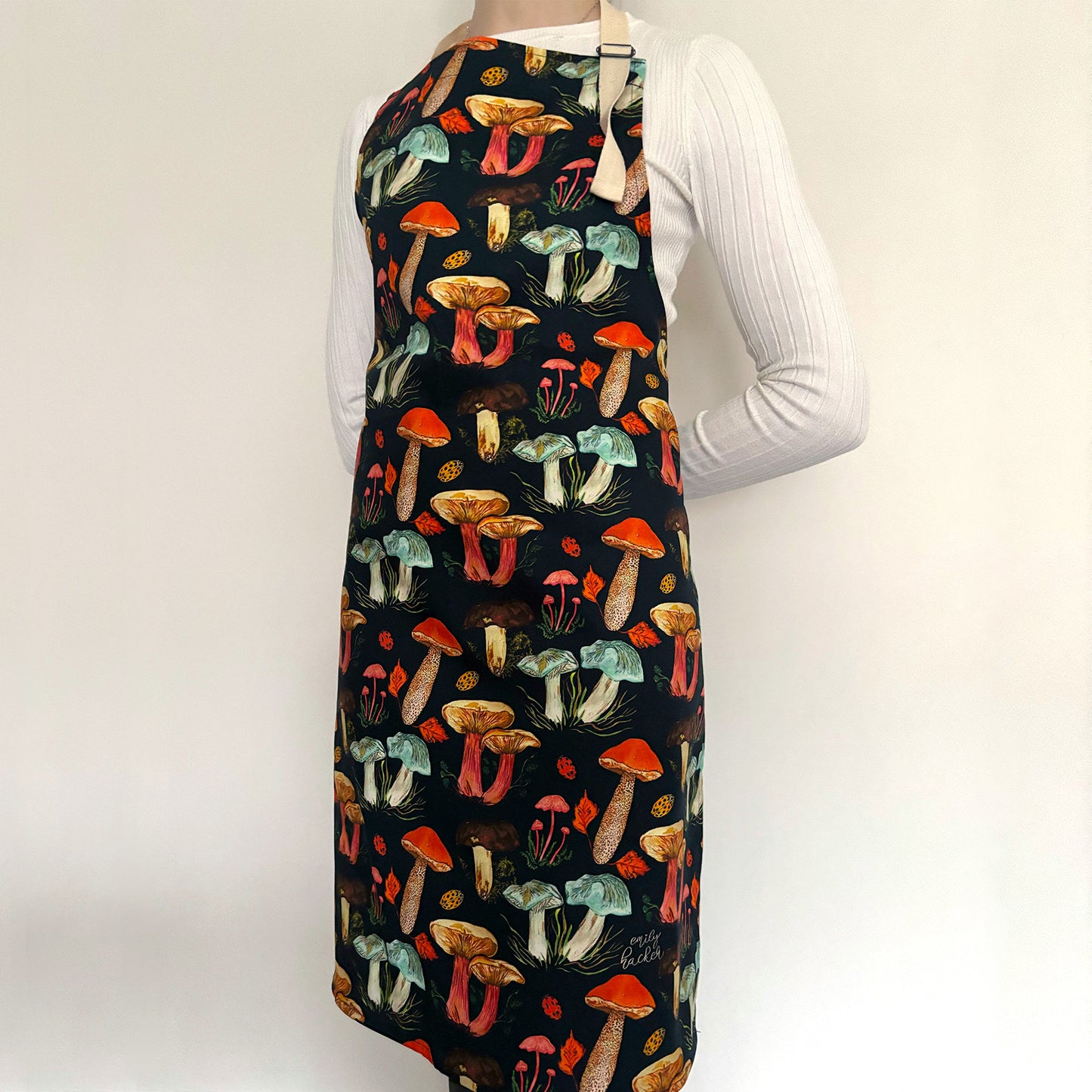 Model wearing mushroom apron