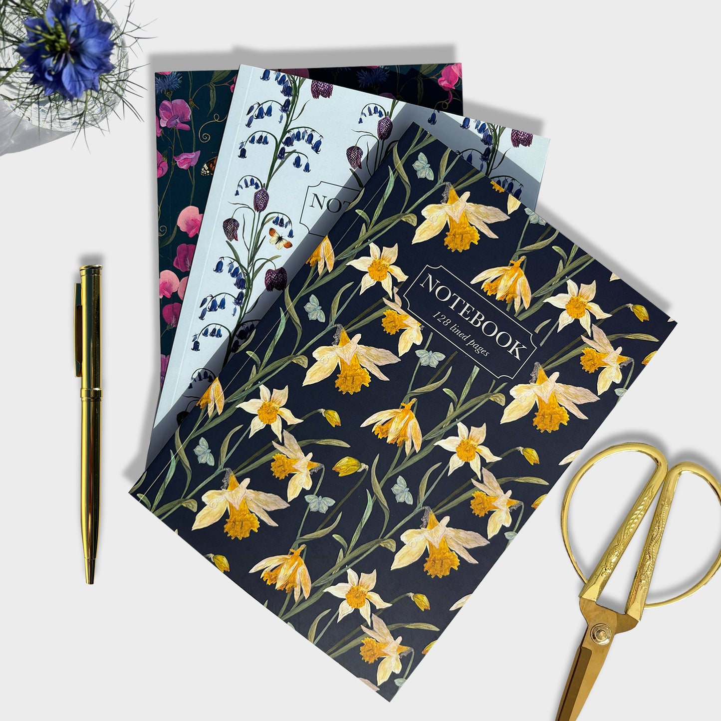 Hand illustrated Floral notebook with a pen and scissors on a white background