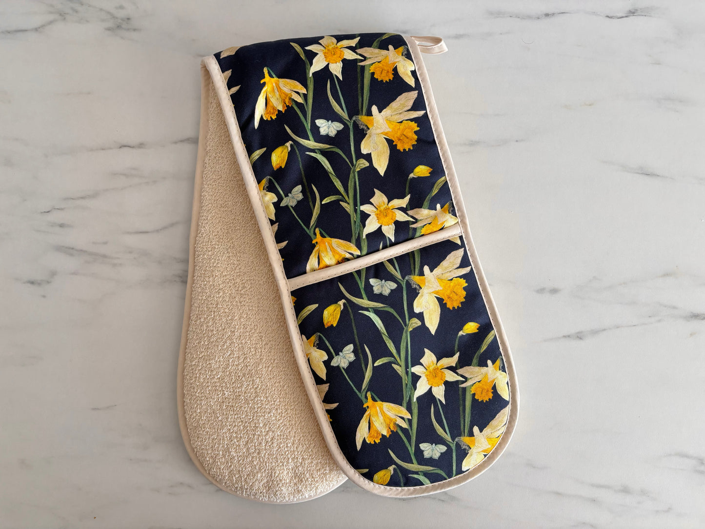 Daffodil oven glove on marble worktop