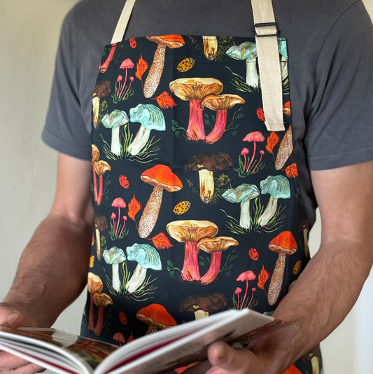 Model wearing mushroom apron