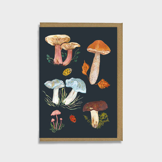 Woodland mushroom greeting card featuring varieties such as amethyst deceiver and boletes on a black background