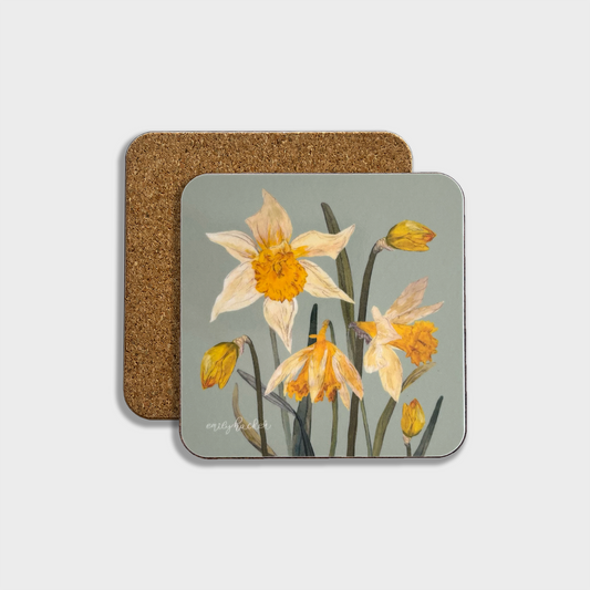 A square coaster with a gloss finish melamine surface featuring a floral design, with a cork backing.