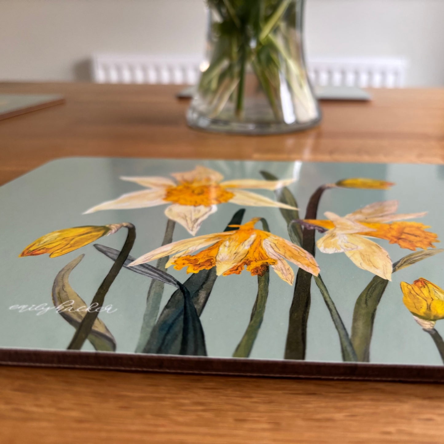 Daffodil design placemat on a wooden table