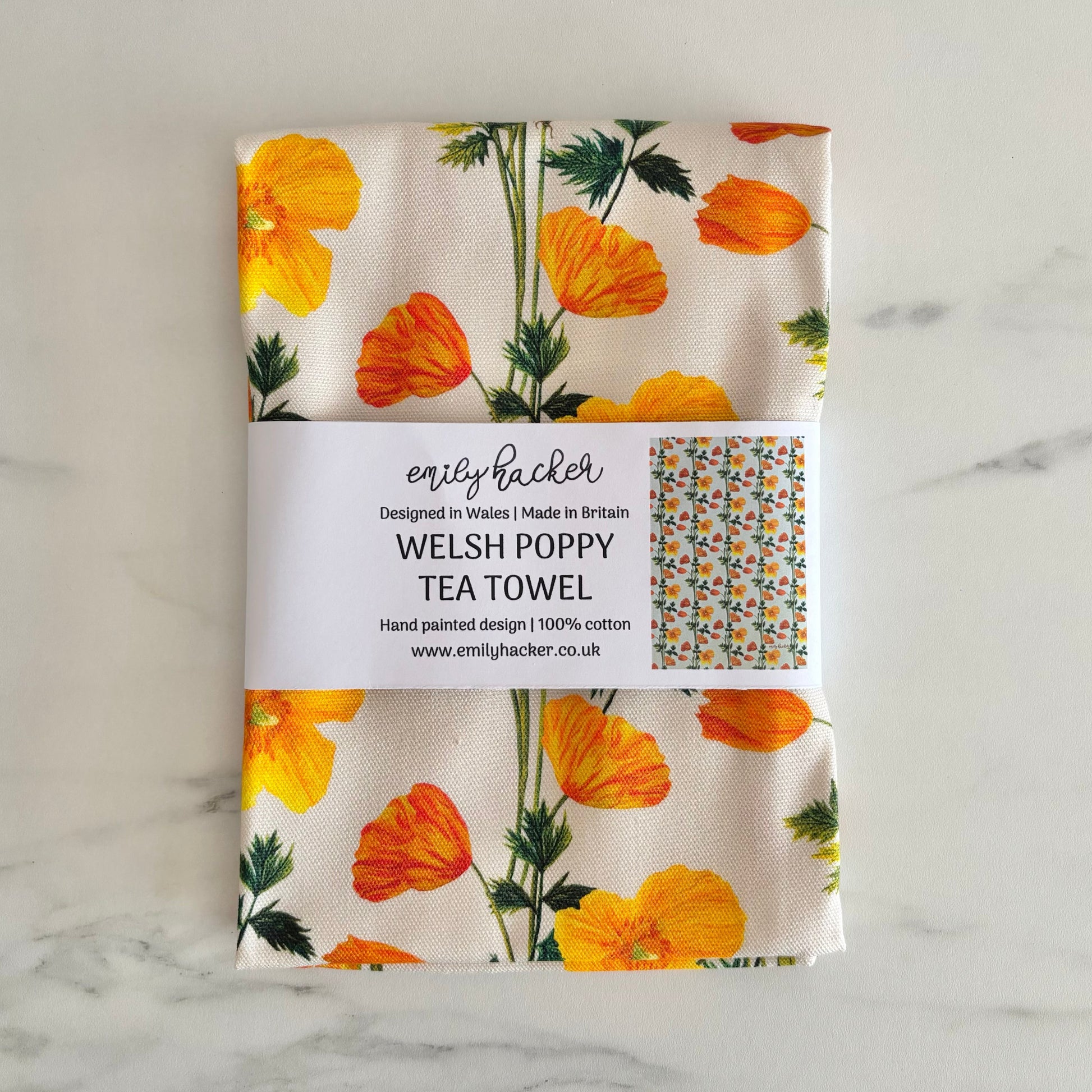 Welsh poppy tea towel featuring hand illustrated yellow and orange poppies