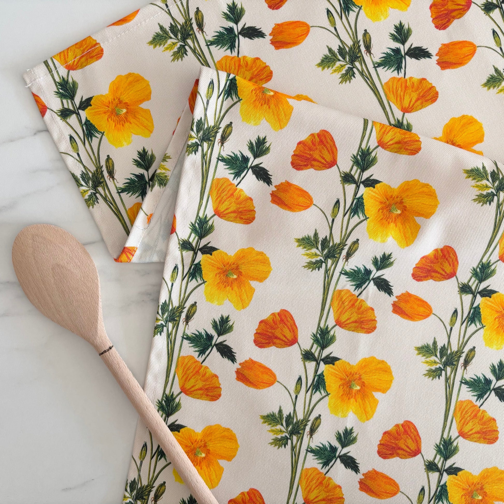 Spring poppy tea towel featuring hand painted floral illustrations on pure cotton
