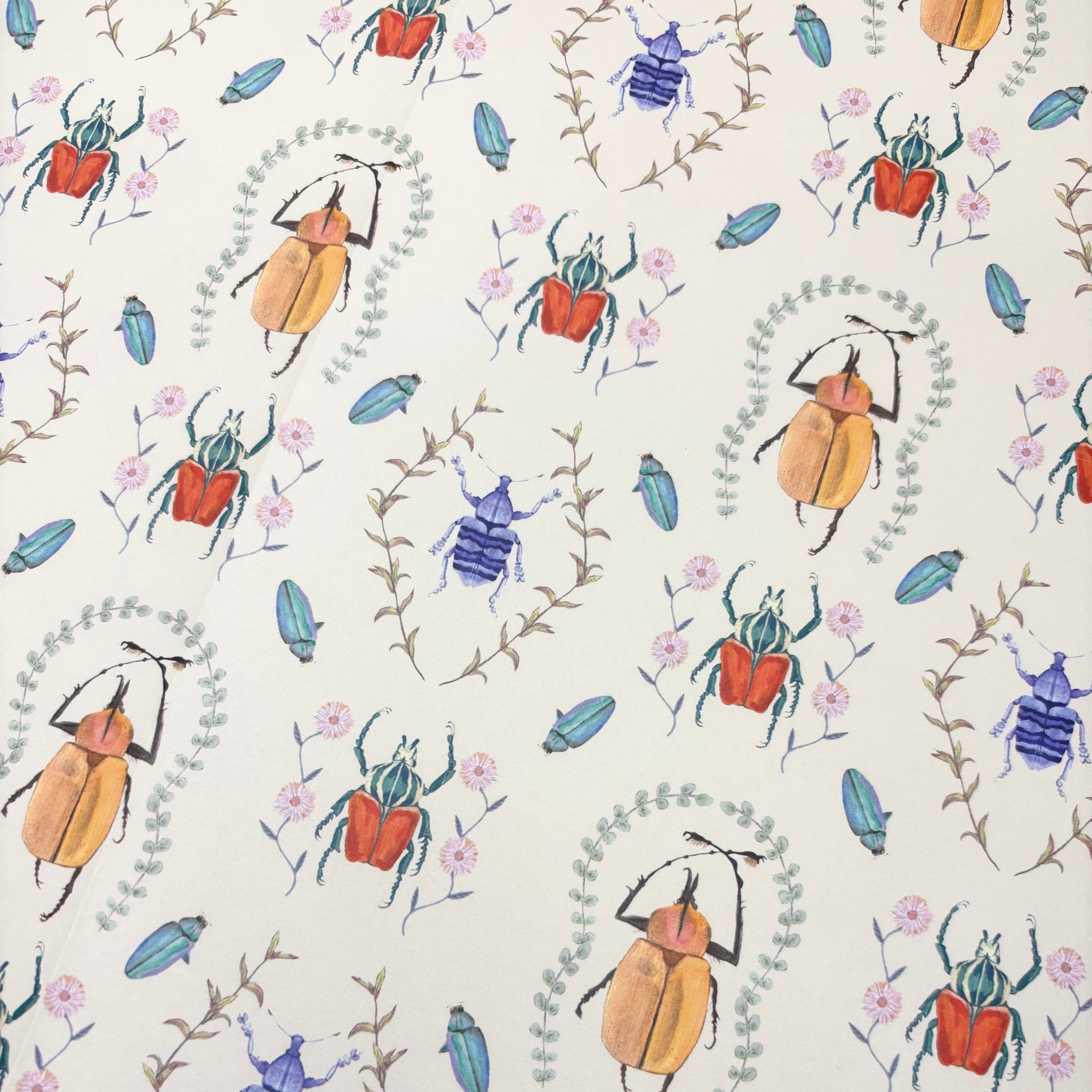 Patterned beetle and floral wrapping paper with colorful beetles and flowers on a white background