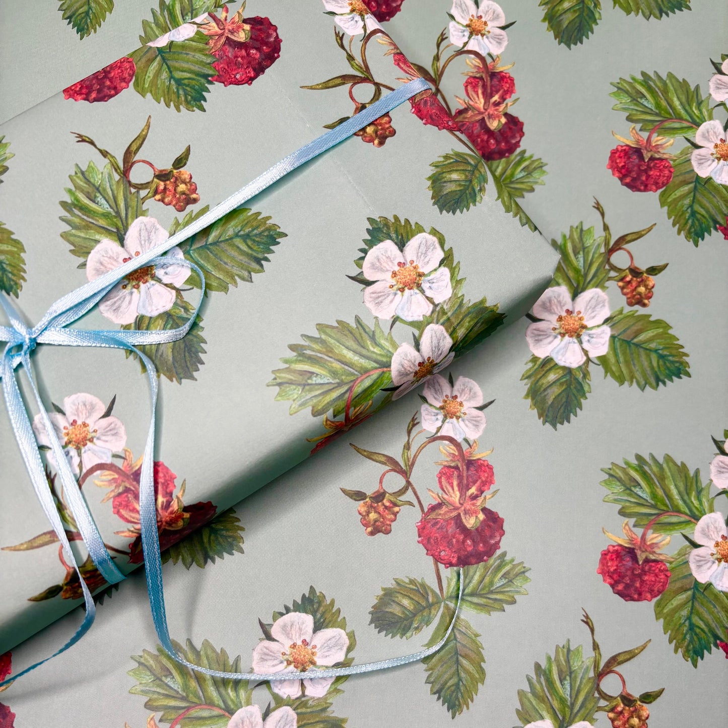Wild Strawberry hand illustrated wrapping paper with blue silk ribbon bow