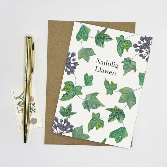 Christmas card with hand painted green ivy leaves and purple ivy berry illustrations on a white background 