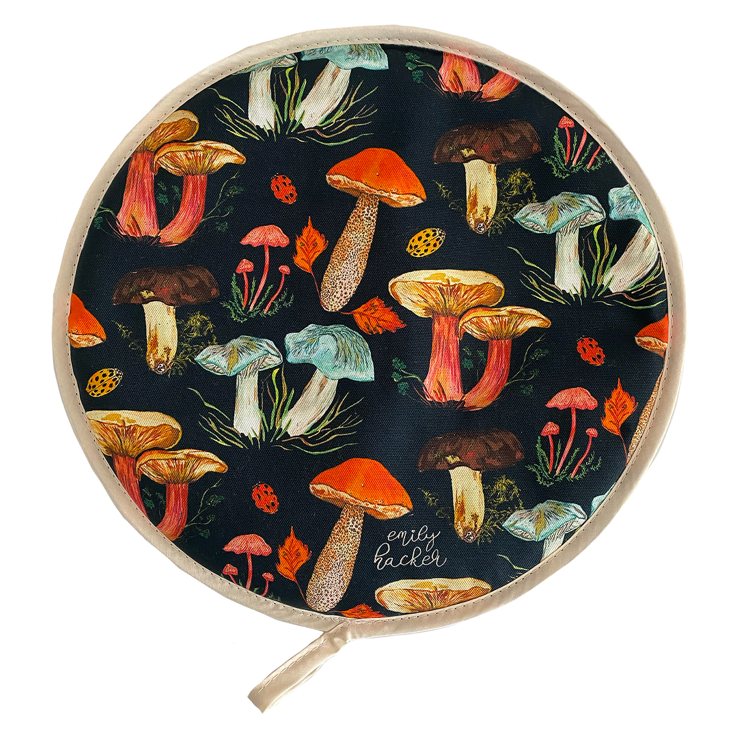 A round AGA hob cover featuring a vibrant hand painted mushroom pattern with a variety of colorful mushrooms displayed across the fabric.