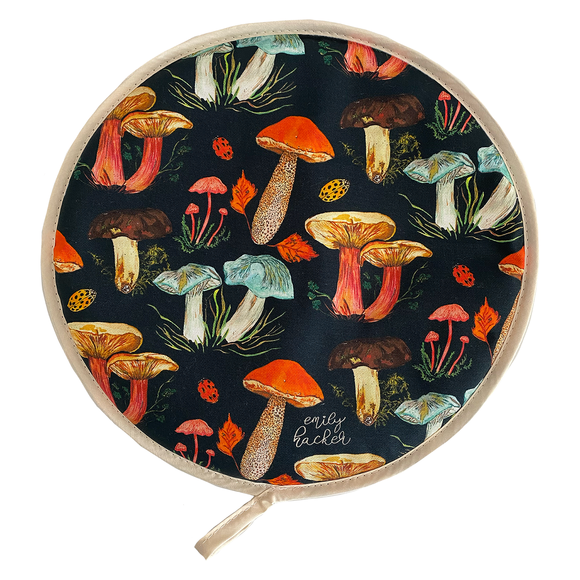 A round AGA hob cover featuring a vibrant hand painted mushroom pattern with a variety of colorful mushrooms displayed across the fabric.