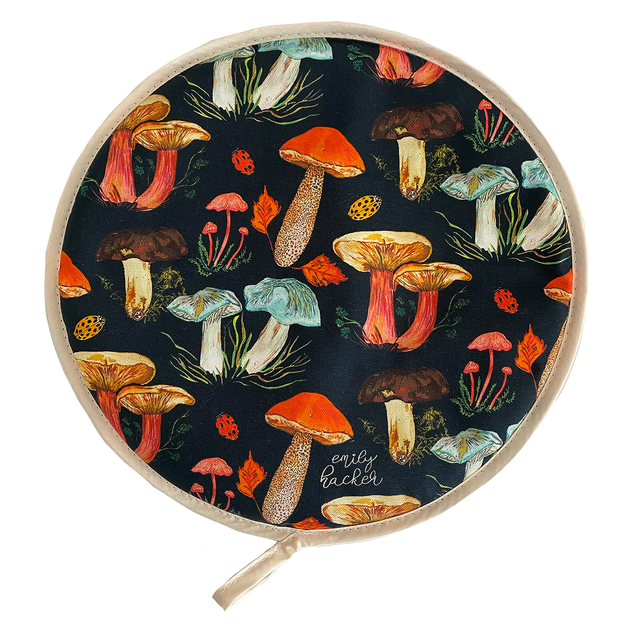 A round AGA hob cover featuring a vibrant hand painted mushroom pattern with a variety of colorful mushrooms displayed across the fabric.