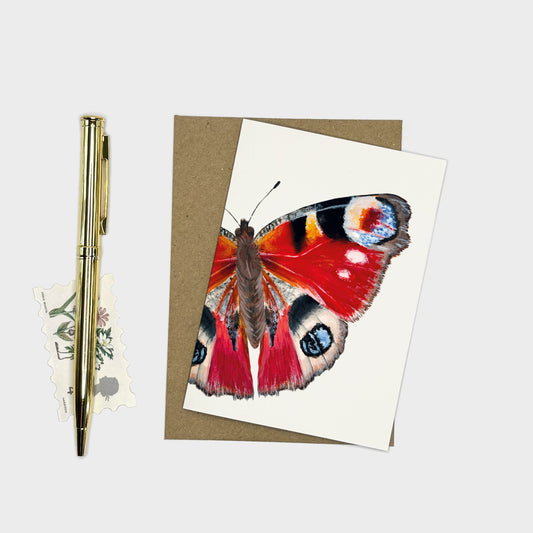 Butterfly art card featuring a striking red peacock butterfly on a cream background