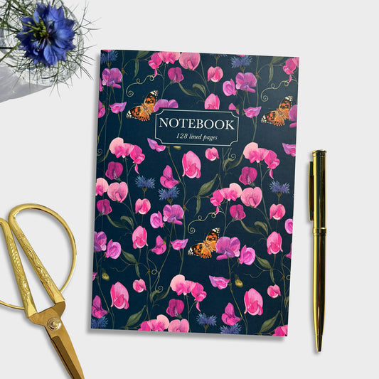 Sweet pea illustrated Floral notebook with butterflies on a white background, accompanied by gold scissors and pen. For journaling, recipe book or mindful doodling