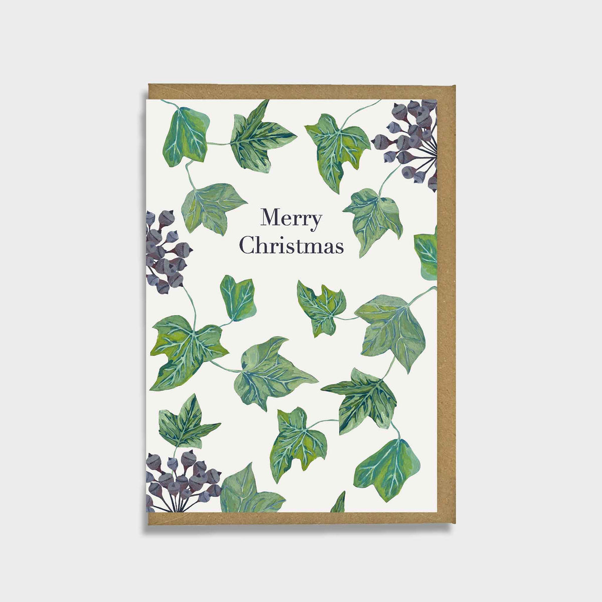 A rectangular Christmas greeting card with a kraft brown border, featuring an off-white center printed with green ivy leaves and dark purple hydrangea-style flowers, with the words 'Merry Christmas' in black serif text.
