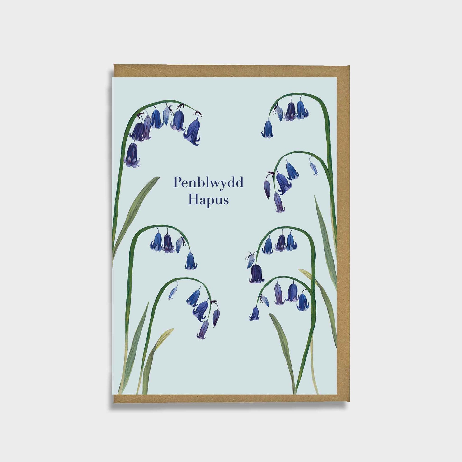 Spring flower Greeting card with bluebell illustrations and 'penblwydd hapus’ message on a light blue background