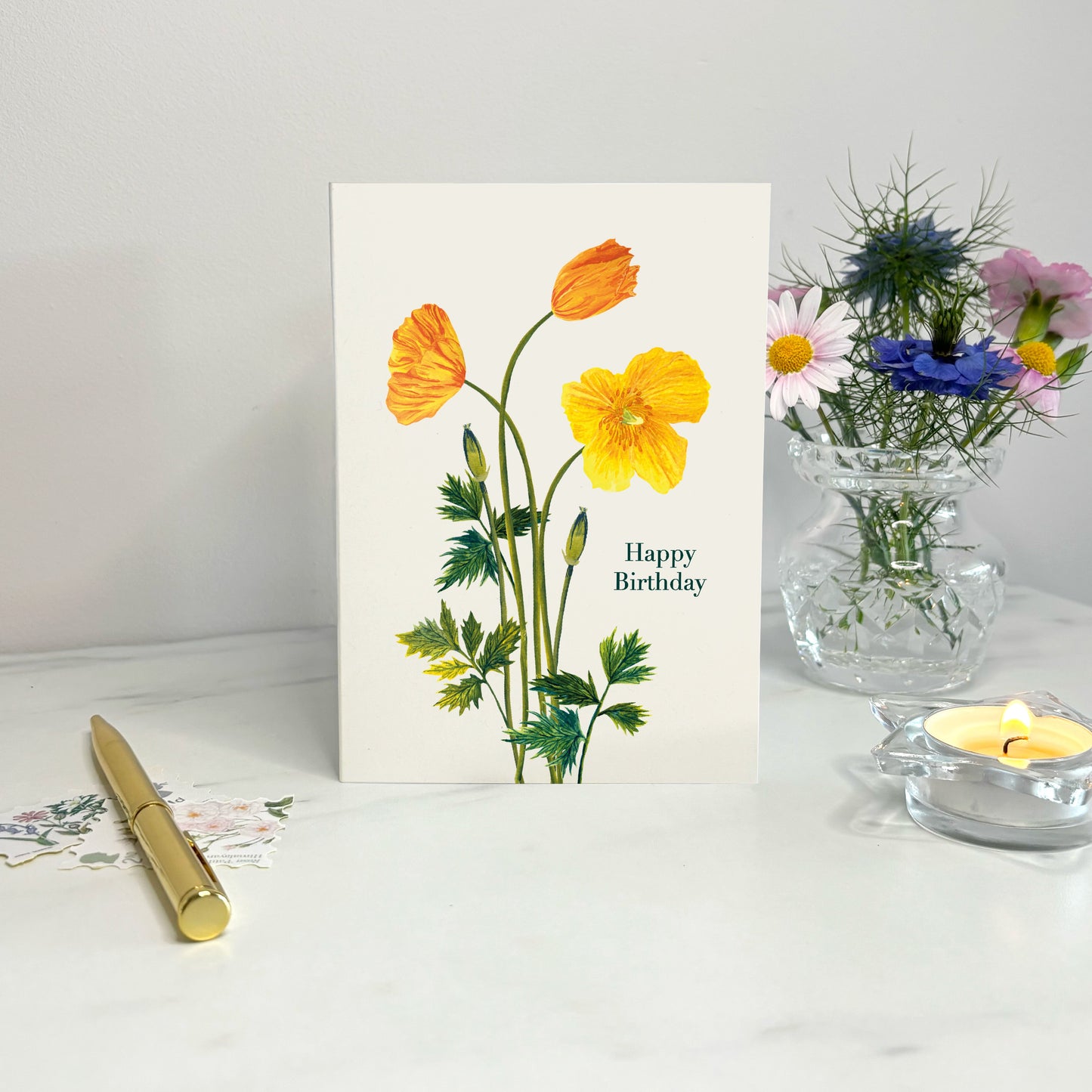 Hand illustrated Welsh poppy happy birthday card decorated with summer wildflowers 