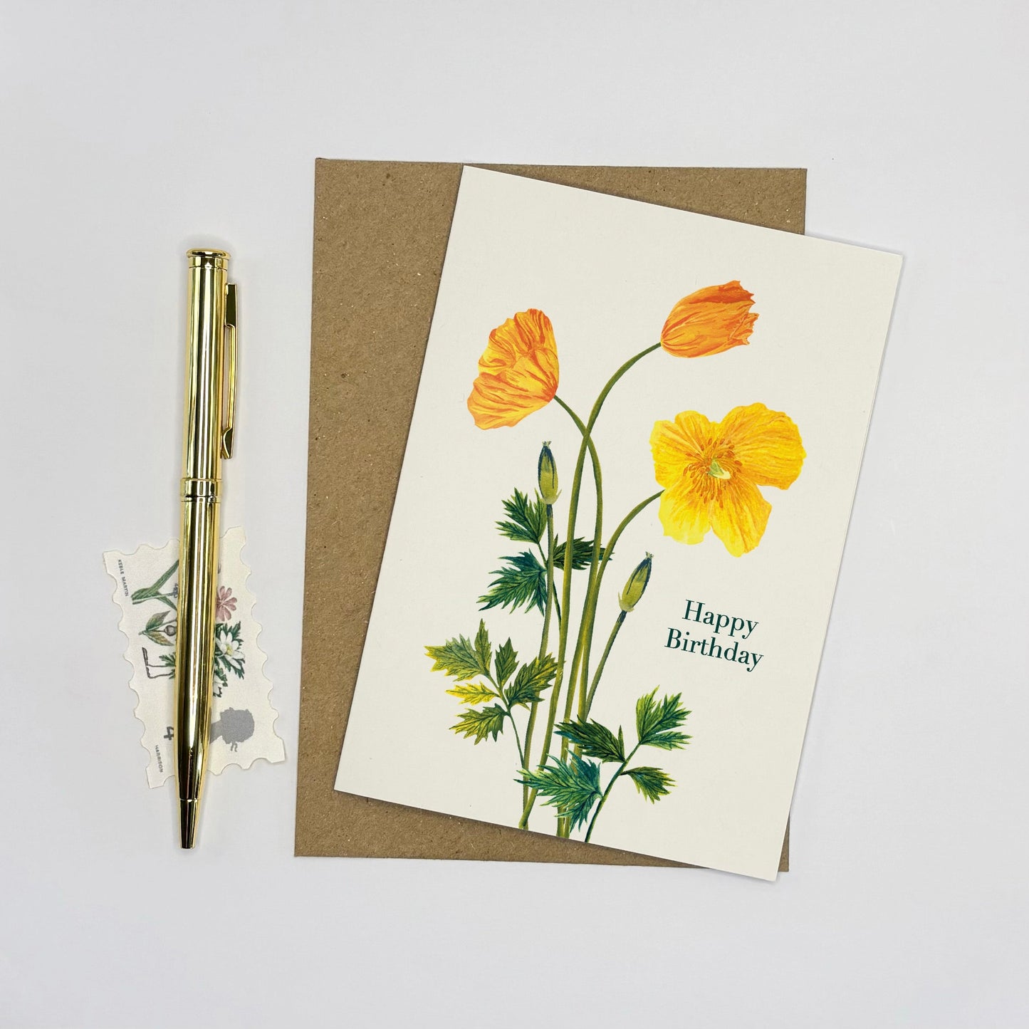 Greeting card with yellow  Welsh poppy flowers and 'Happy Birthday' text on a white background