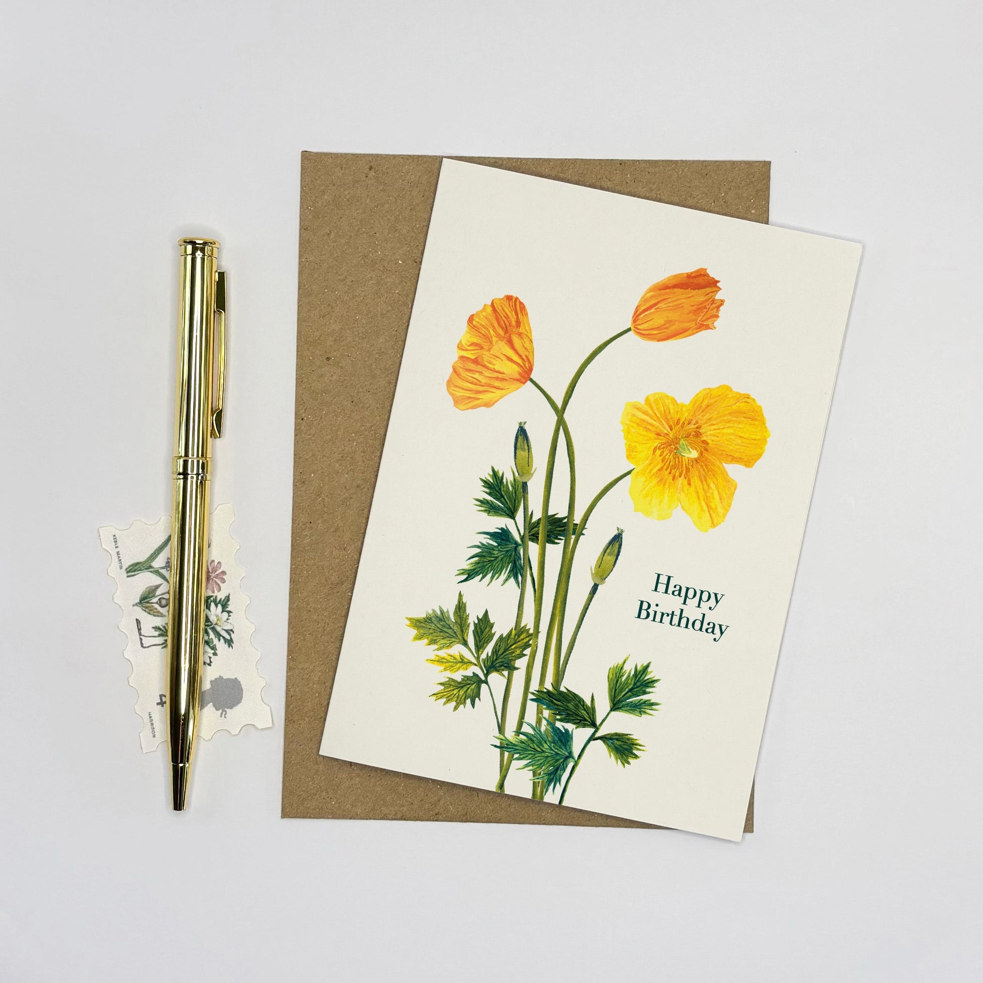 Greeting card with yellow  Welsh poppy flowers and 'Happy Birthday' text on a white background