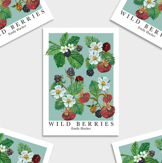 A mini botanical art print titled 'WILD BERRIES' by Emily Hacker, featuring detailed illustrations of red, black, and white berries with green leaves on a light teal background, shown on a light gray surface with partial duplicate prints around it.