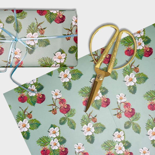 Strawberry and Floral-patterned hand illustrated wrapping paper with gold scissors on a matching background