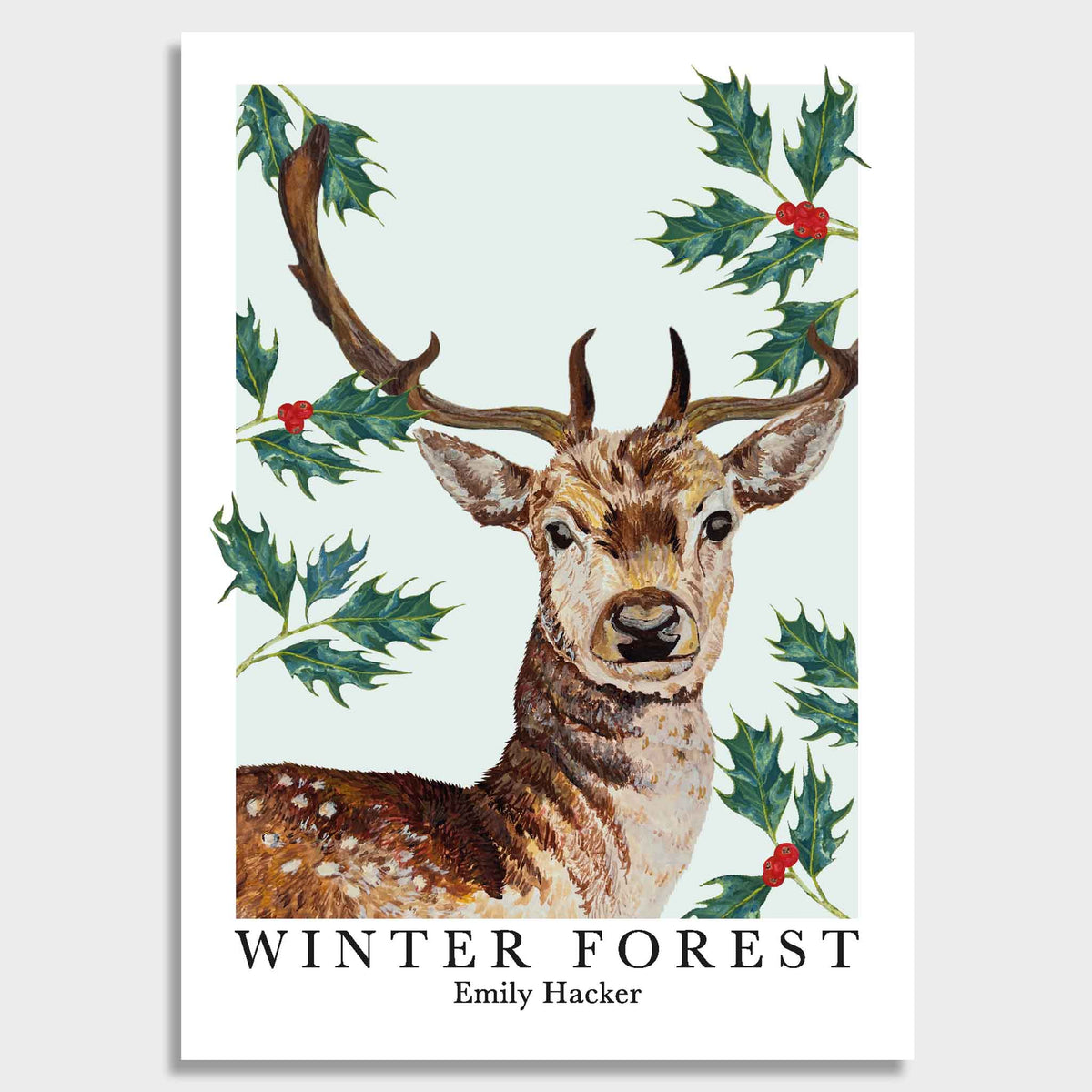 A winter forest art print featuring hand illustrated fallow deer buck, Holly leaves and berry illustrations against a light blue background with the tittle ‘winter robin by Emily Hacker’ below.