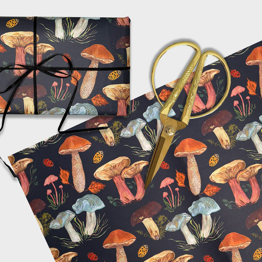 Woodland Mushroom pattern illustrated  wrapping paper with gold scissors on a white background